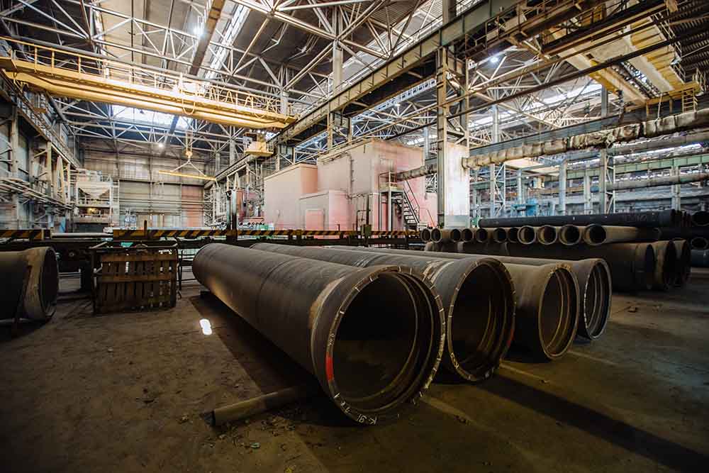 New cast iron pipes for pipeline construction in warehouse