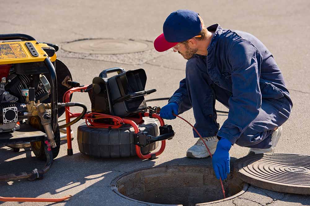 technician conducting a sewer camera inspection